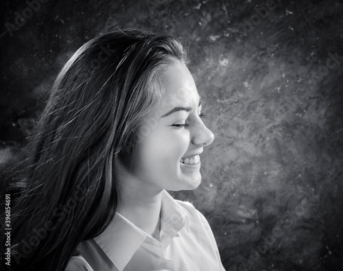 Beautiful teen girl dressed in white shirt close up view