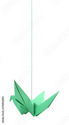 A green paper origami bird hanging