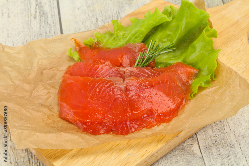 Sliced salmon fillet served rosemary Sliced salmon fillet served rosemary