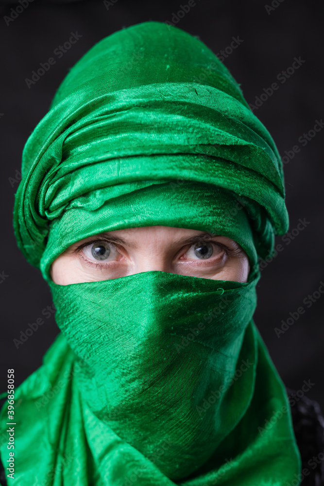 Beautifu musliml woman dressed in green headscarf Beautifu musliml woman dressed in green headscarf