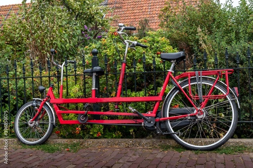 Red tandem parked on a street in Edam, Holland