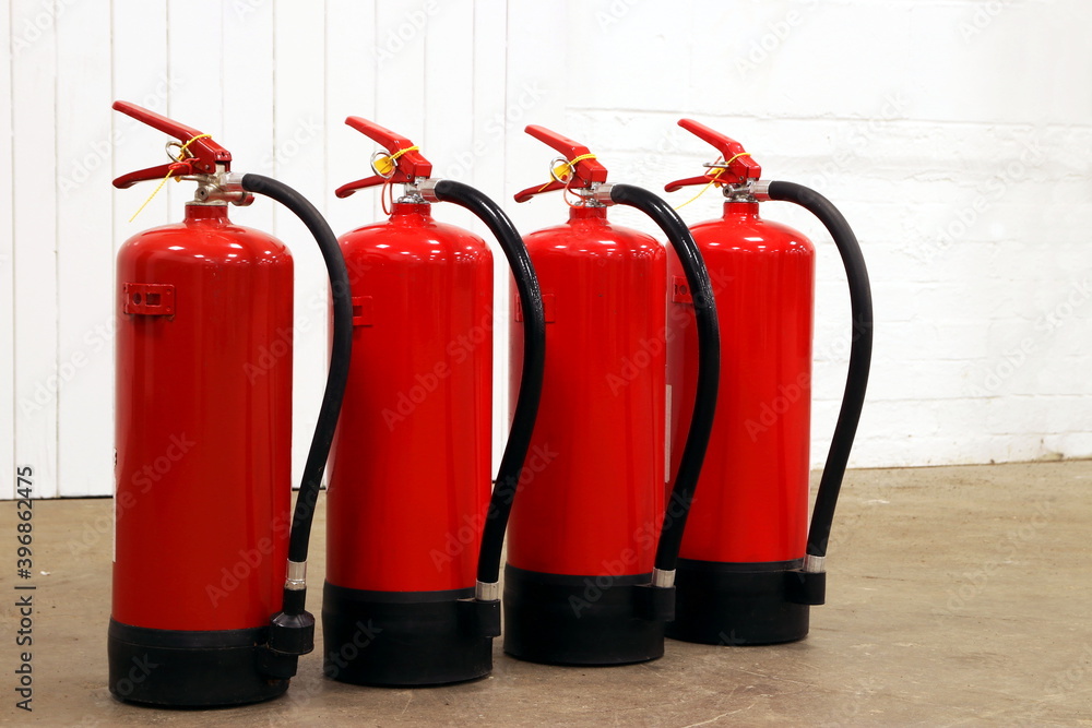 Obraz premium Fire extinguishers lined up for use.