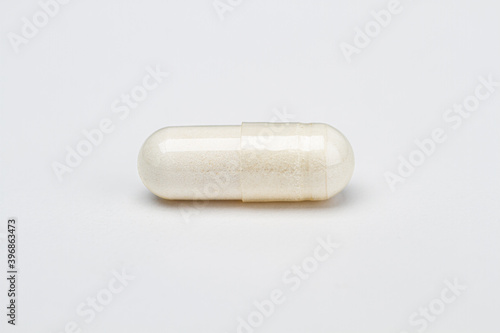 Pill filled with white ingredient photo