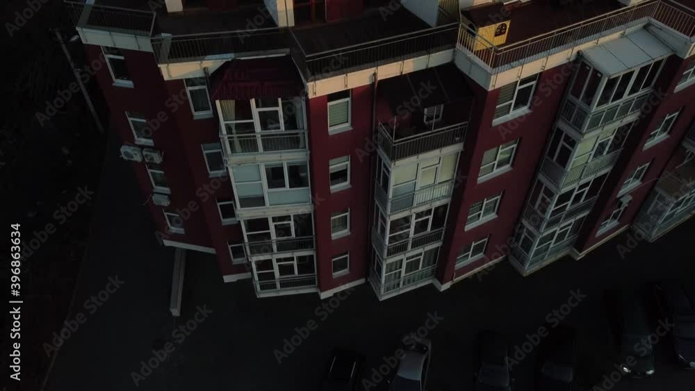 Aerial view of a drone flying over the residential building. Aerial view of a drone flying over the residential building.