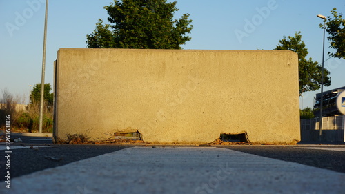 cement jersey barrier against blue sky background