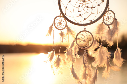  Obrazy Indianie   beautiful-handmade-dream-catcher-near-river-at-sunset-space-for-text