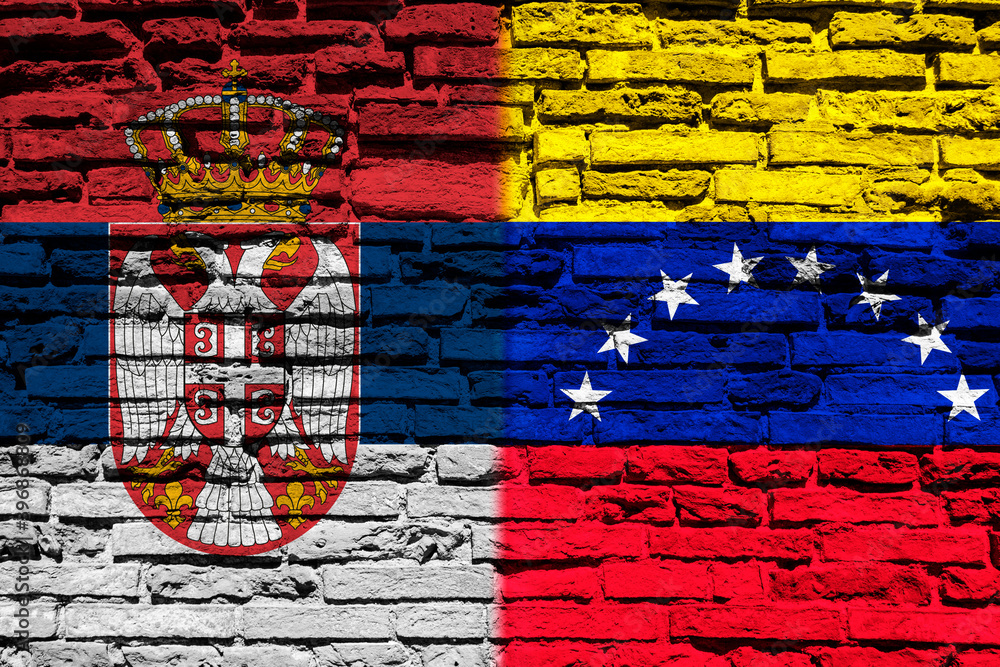 Flag of Serbia and Venezuela on brick wall