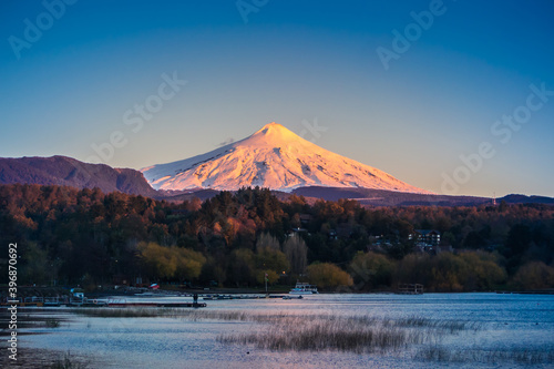 Pucon / Auracania / Chile: Sunset view to Villarrica Volcano and the lake. photo