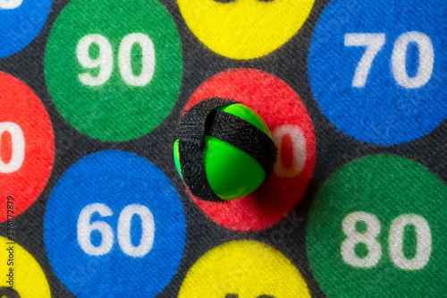 Foto Children's Darts.Velcro balls defeat the target.Close up.