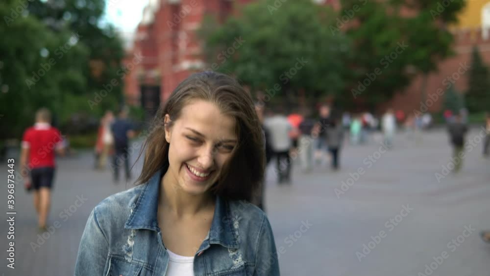 Beautiful girl with a smile on the background of the city Beautiful girl with a smile on the background of the city