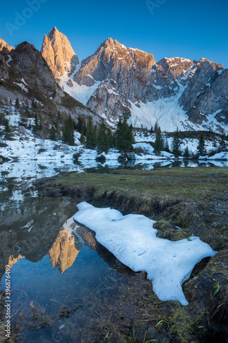 Spring thaw below Bagozza peak in Italian Alps, Lombardy, Italy photo