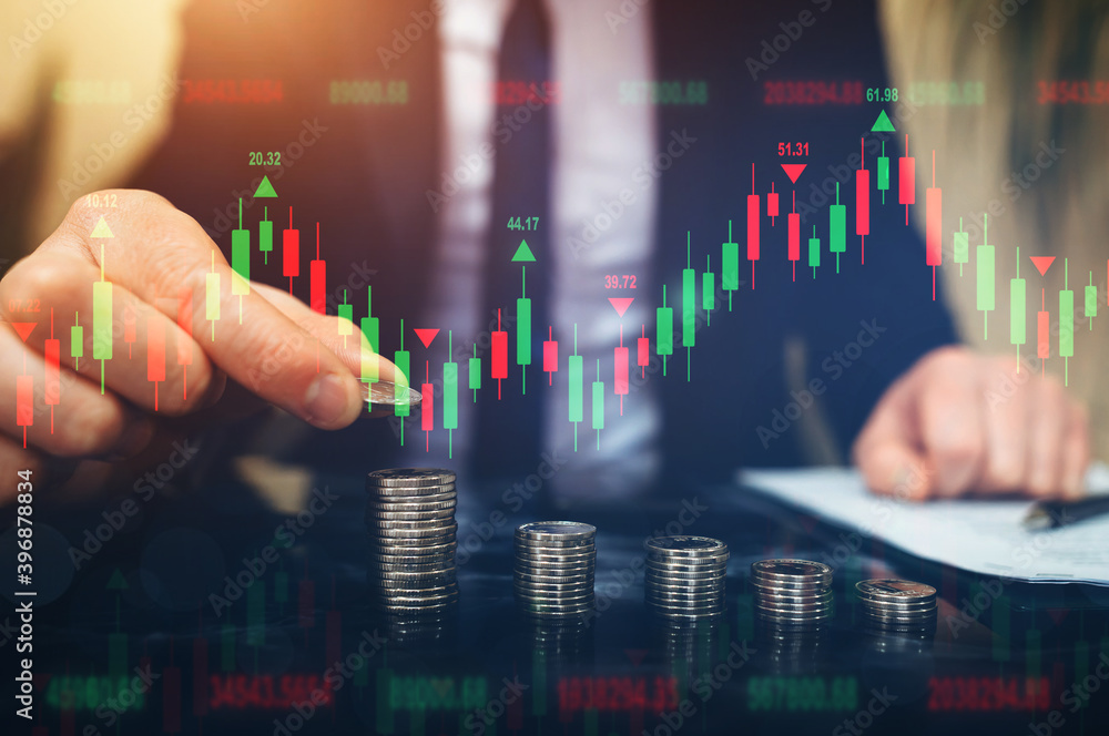 Businessman putting coin stack with financial graph. Forex investment business. Successful businessman. Businessman putting coin stack with financial graph. Forex investment business. Successful businessman.