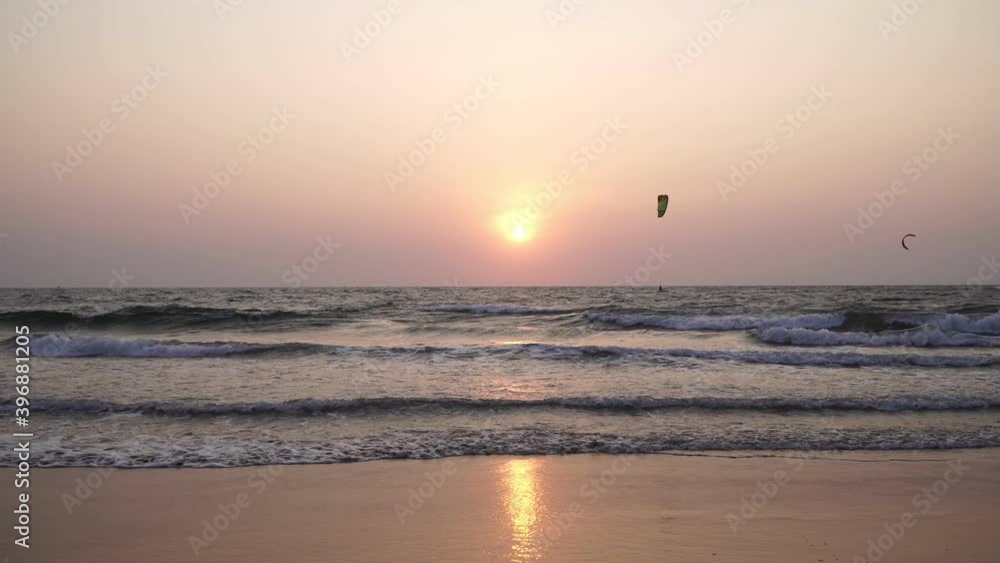 Golden sunset over the ocean, sandy beach and waves. Beautiful evening sea background Golden sunset over the ocean, sandy beach and waves. Beautiful evening sea background