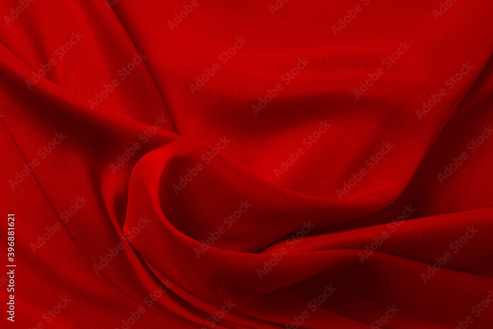 Red silk or satin luxury fabric texture can use as abstract background. Top view. Red silk or satin luxury fabric texture can use as abstract background. Top view.