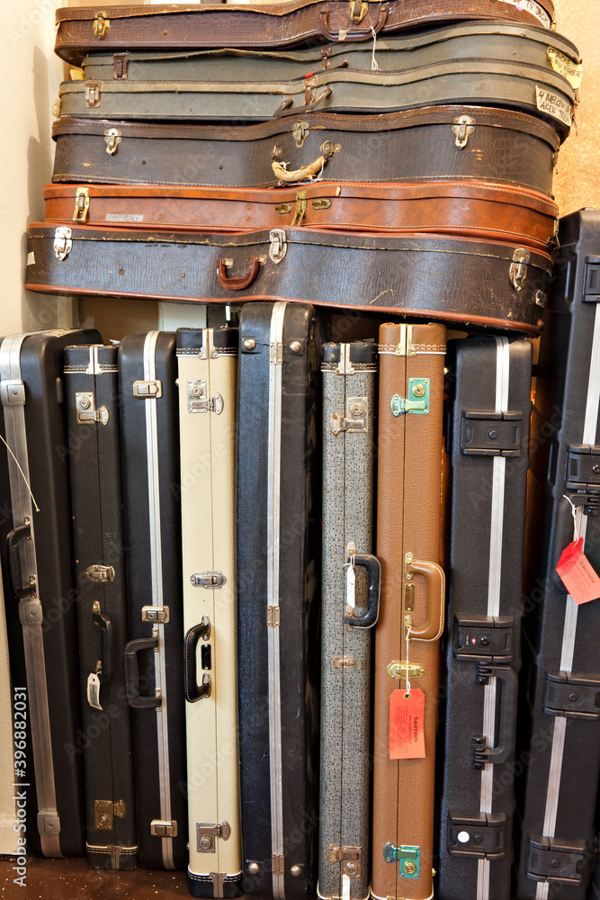 Group of old guitar case in music store