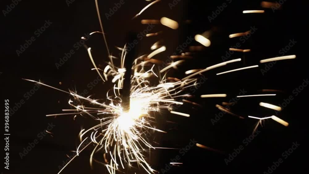 holiday lights and sparks, sparklers on a dark background. flammable. new year holiday holiday lights and sparks, sparklers on a dark background. flammable. new year holiday