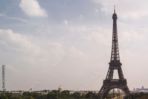 Image of the Eiffel tower against a blue sky. Copy space. Architecture concept. © Ana
