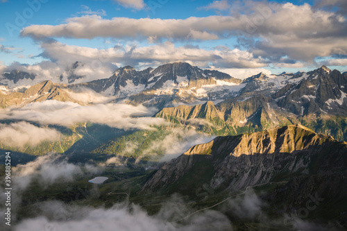 Mountain landscape in the clouds, Italian Alps, Stelvio National Park, Lombardy photo