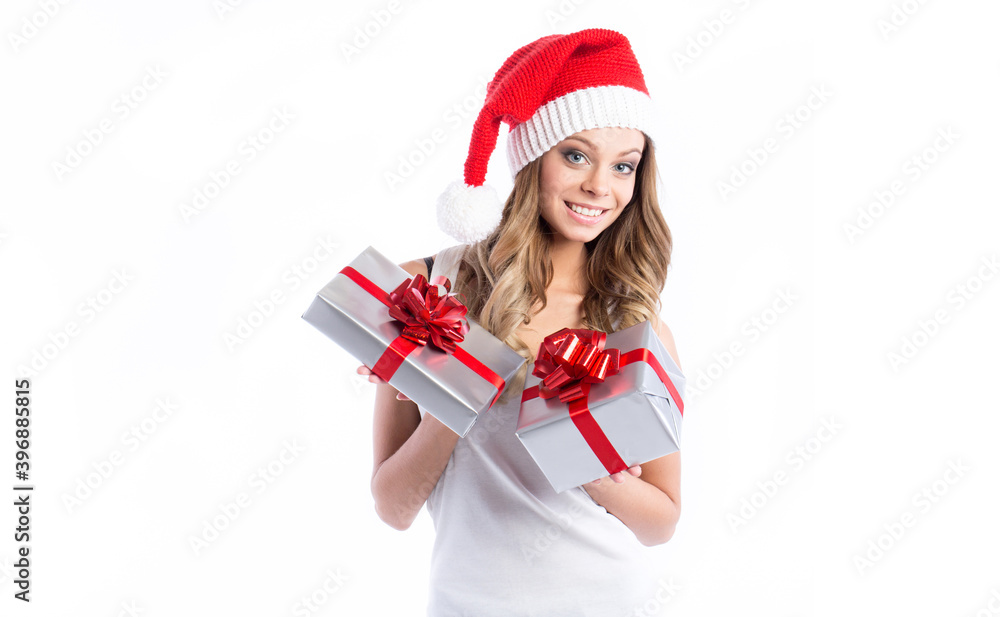 Happy excited young woman in santa claus hat with gift box on white. Happy excited young woman in santa claus hat with gift box on white.