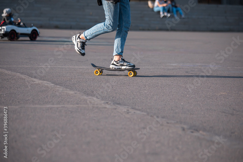 Skater legs skating at skatepark