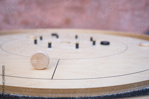 Crokinole table with the white piece on it's side