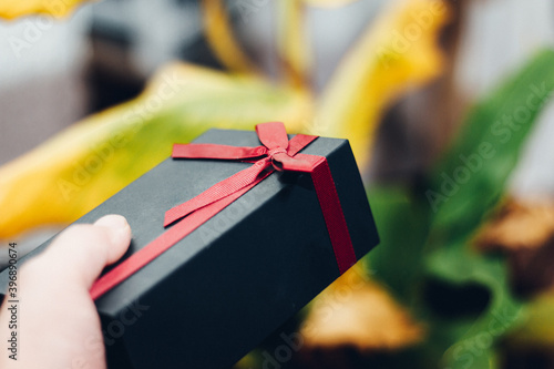 Holding a gift box - image of scene about celebration / holiday season / birthday / christmas / Valentain's day photo