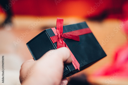 Holding a gift box - image of scene about celebration / holiday season / birthday / christmas / Valentain's day photo