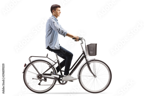 Profile shot of a casual guy riding a bicycle