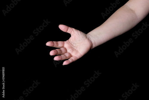 female hands together on black background, old skin with wrinkles and veins, concept of health, age-related changes, love, isolated image