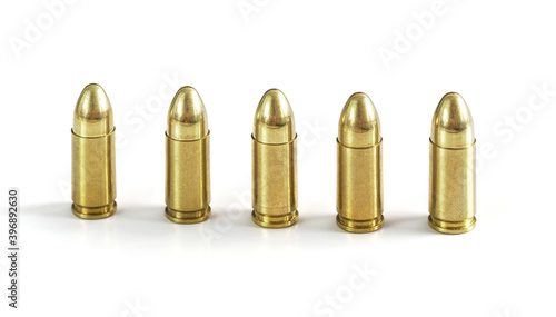 Wallpaper Mural Five yellow brass ammo bullets isolated on white background, arranged standing next to each other Torontodigital.ca