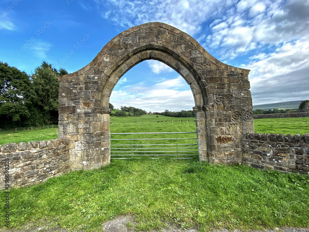 Old stone arch, near the ruins of an Abbey, on a hot summers day in, Sawley, Clitheroe, UK