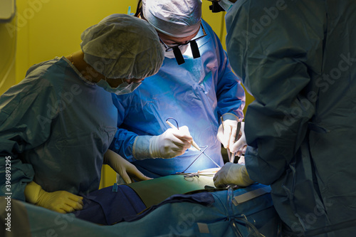 Surgeons in the operating room do operation