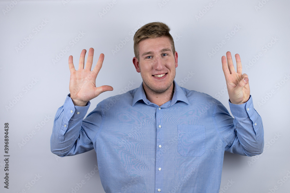 Business young man wearing a casual shirt over white background smiling confident and happy showing number eight with fingers Business young man wearing a casual shirt over white background smiling confident and happy showing number eight with fingers
