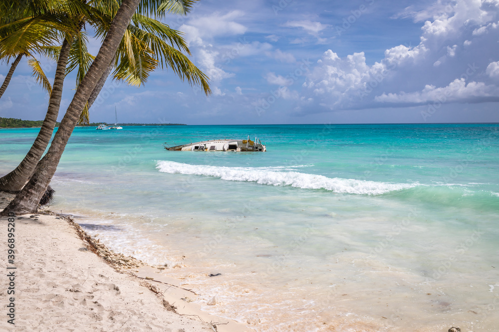 Half sunken yacht on the island of Saona. Dominican Republic, Beach on Saona island.