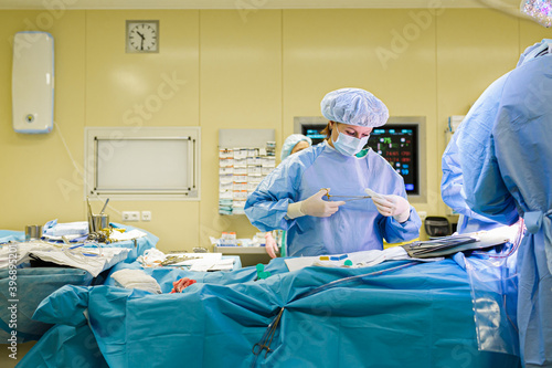 The doctor's assistant helps the surgeon during the operation