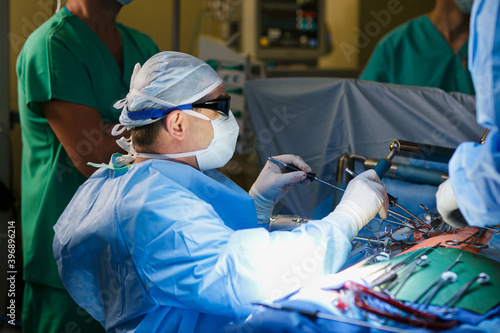 Surgeons in the operating room do operation