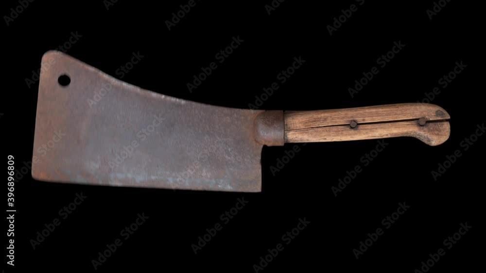 An Isolated Old Fashioned Meat Cleaver Coming Down Suddenly In A Chopping Motion An Isolated Old Fashioned Meat Cleaver Coming Down Suddenly In A Chopping Motion