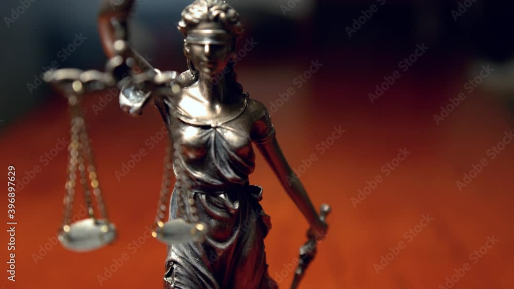 The Statue of Justice - lady justice / Justitia in lawyer office The Statue of Justice - lady justice / Justitia in lawyer office