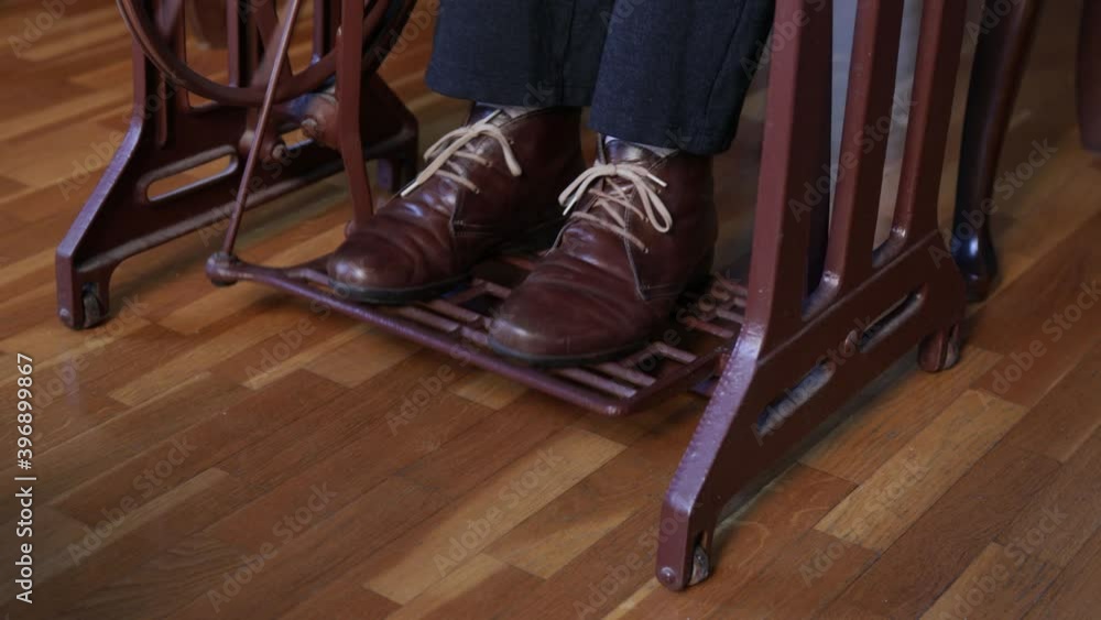 Female feet pressing pedal of sewing machine Female feet pressing pedal of sewing machine