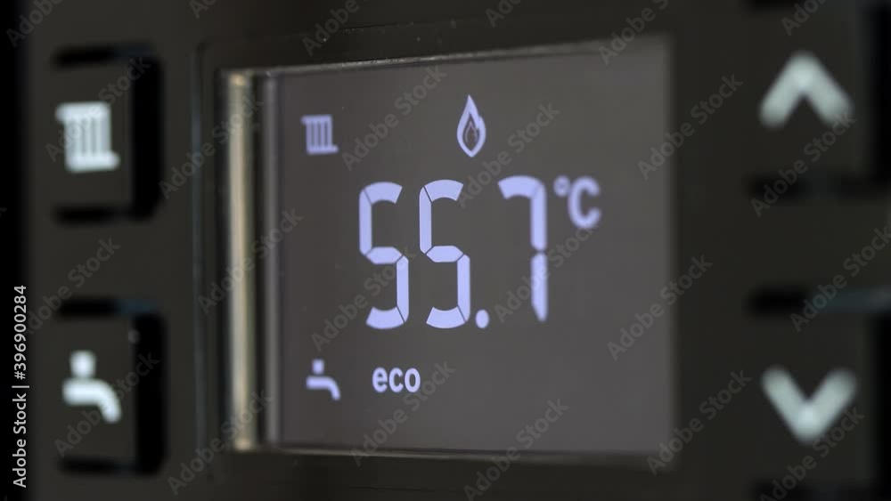 Control panel with display of the working gas boiler for hot water and heating. The smart control panel household gas boiler, close up. Control panel with display of the working gas boiler for hot water and heating. The smart control panel household gas boiler, close up.