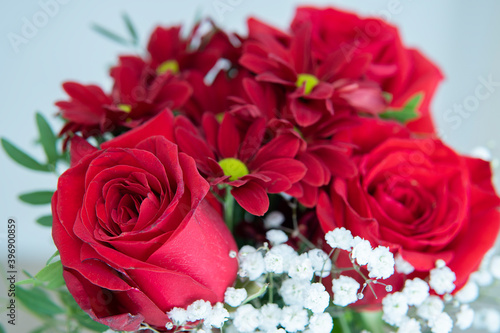 bouquet of flowers. red roses and red daisies