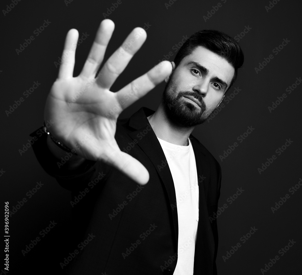 Handsome bearded man in stylish casual clothes and jacket standing and showing five fingers on hand to camera over dark background. Stylish business casual style for men concept Handsome bearded man in stylish casual clothes and jacket standing and showing five fingers on hand to camera over dark background. Stylish business casual style for men concept