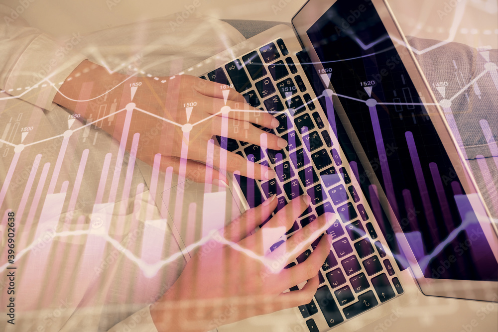 Double exposure of woman hands working on computer and forex chart hologram drawing. Top View. Financial analysis concept. Double exposure of woman hands working on computer and forex chart hologram drawing. Top View. Financial analysis concept.