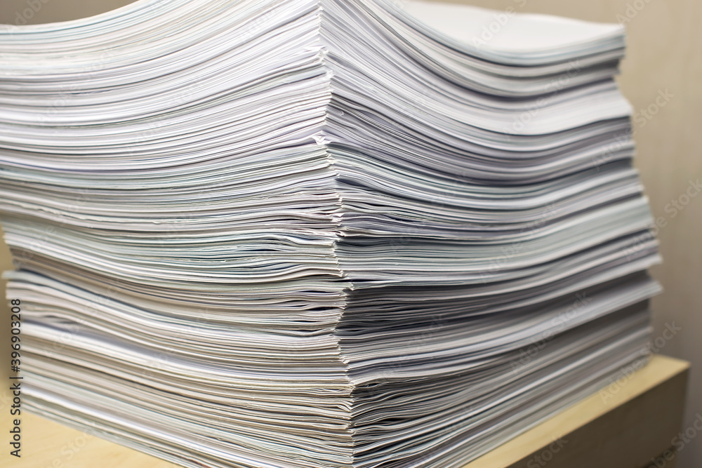 bundles bales of paper documents. stacks packs pile on the desk in the office bundles bales of paper documents. stacks packs pile on the desk in the office