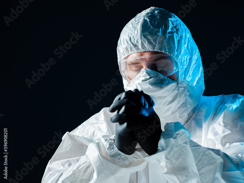 A medic in a protective sui...