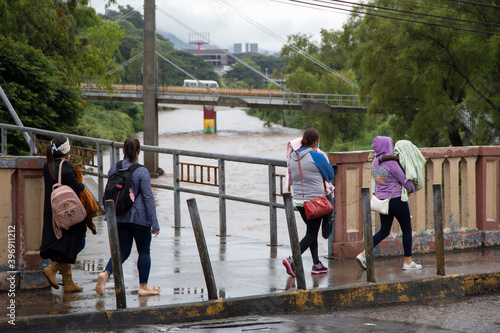 Some women walking fast as the ETA Hurricane is near of Tegucigalpa City