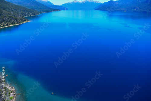 landscape of a deep blue lake of argentine patagonia near bariloche
