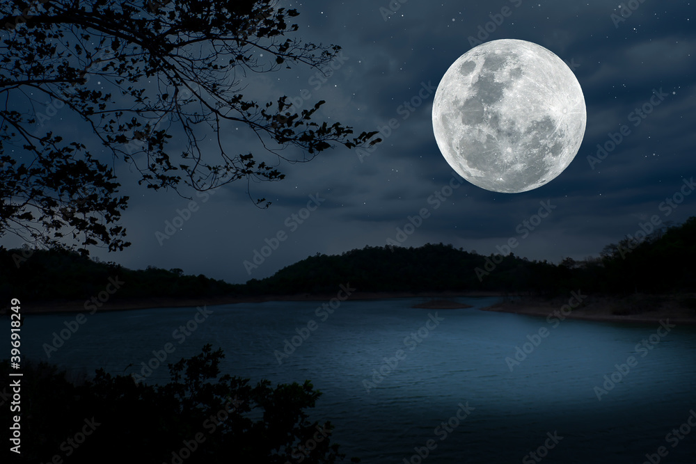 Full moon on the sky over lake at night. Full moon on the sky over lake at night.