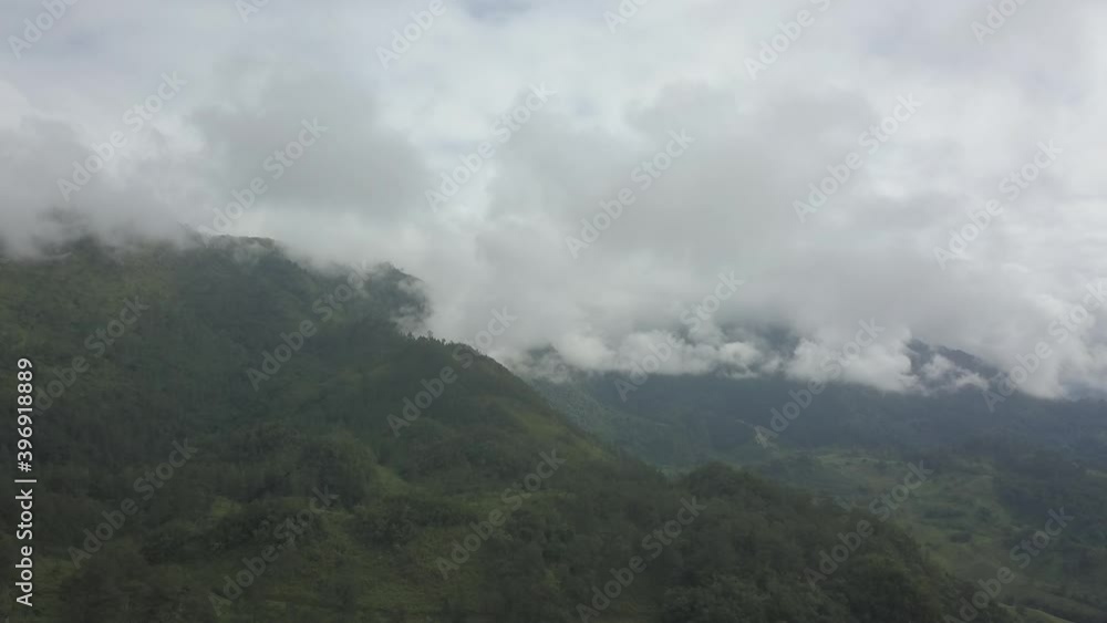 Drone aerial hyperlapse flying over the mountains and a tropical landscape in Guatemala during a cloudy day Drone aerial hyperlapse flying over the mountains and a tropical landscape in Guatemala during a cloudy day