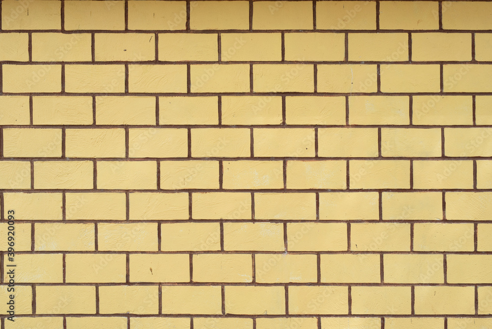 Obraz premium old yellow brick wall texture background